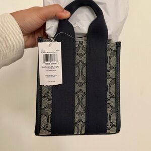 COACH Smith Mini Tote Bag
In Signature Jacquard navy